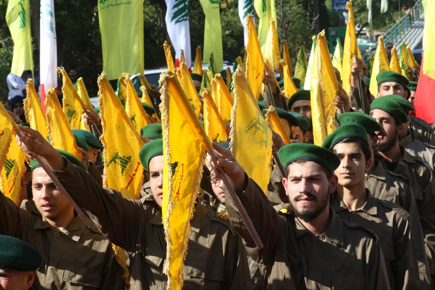 Hezbollah fighters take part in a military parade marking the group's Martyrs' Day in the southern town of Ghazieh, south of the port city of Sidon, 12 November 2019