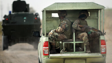 Nigerian soldiers patrolling Borno state near a former Boko Haram camp