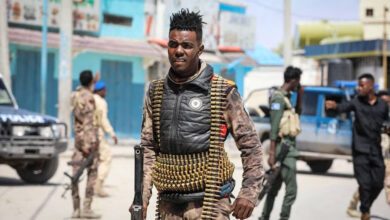 Security officers patrol near the destroyed Hayat Hotel after a deadly 30-hour siege by al-Shabab militants in Mogadishu