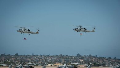 Two MH-60R Seahawks helicopters participated in a formation flyover during a ceremony where the Indian Navy received its first two MH-60Rs from the US Navy